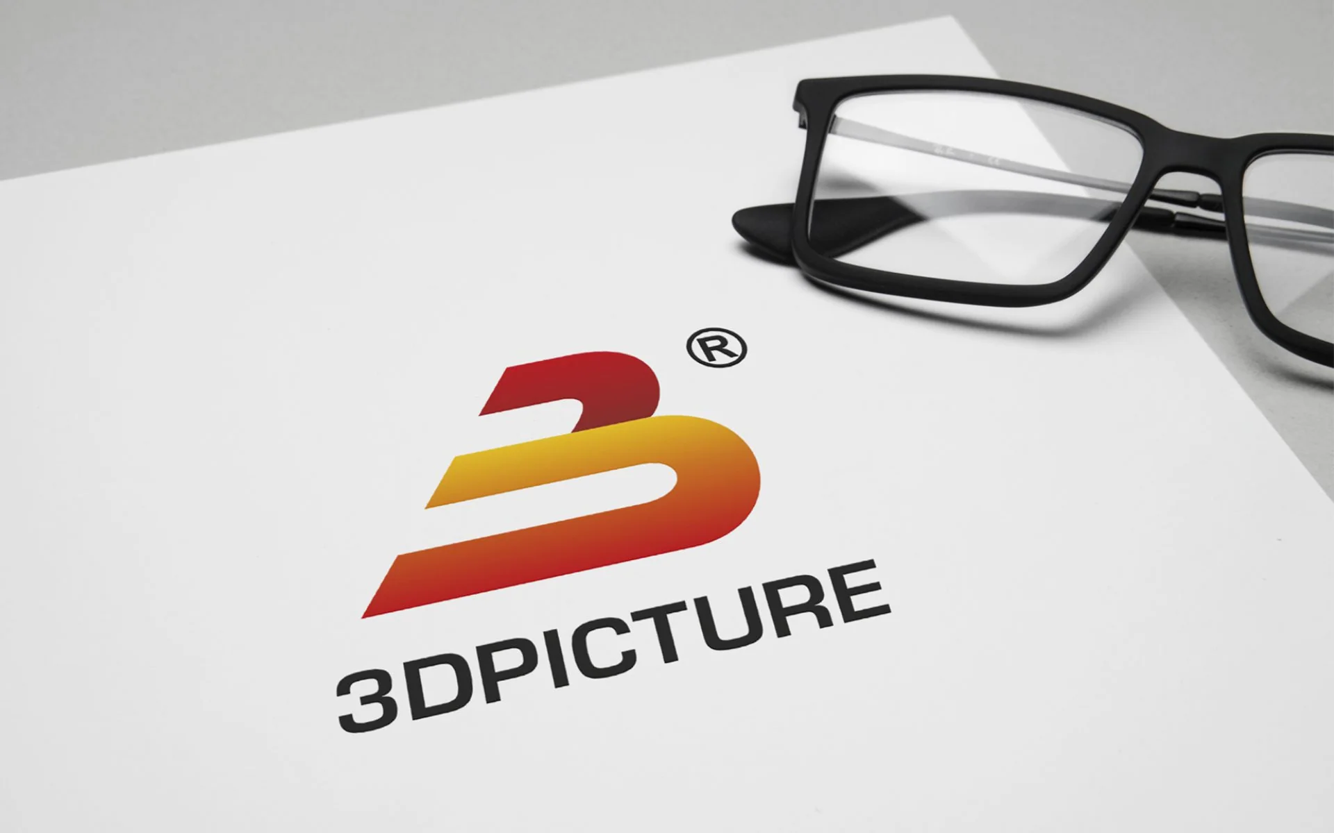 Логотип 3DPicture на бумаге рядом с очками